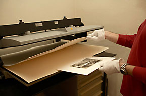 Matt board and print are inserted  in the press for the final mounting.  Photo Daniele Gussago